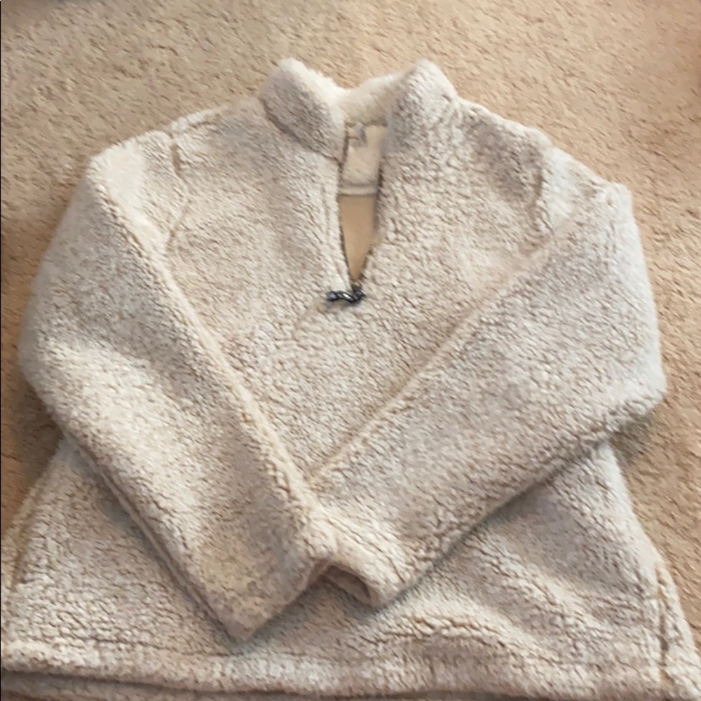 Cream colored fluffy Sherpa quarter zip